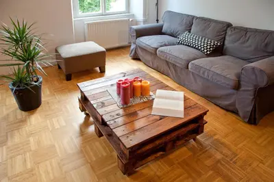 a living room with a couch and a coffee table at Apartment REZIDENCA GOGA in Novo Mesto