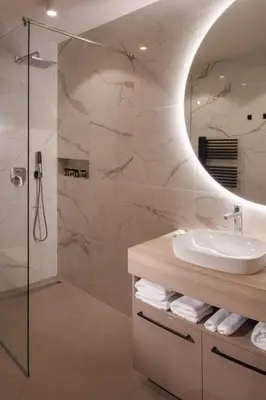 a bathroom with a sink and a shower at HIŠA PUTR in Trzin