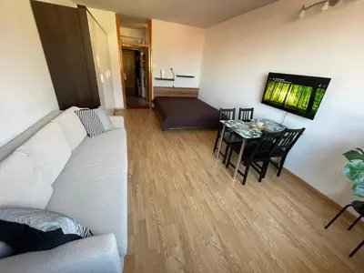 a living room with a white couch and a table at Apartment in Ljubljana center in Ljubljana
