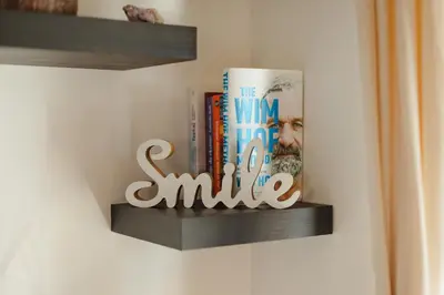 a shelf with books and a sign that says the way toaila at VILA KLARA apartments in Ljubljana