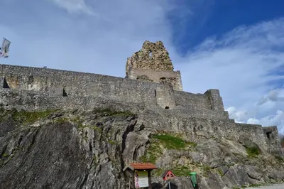 a castle on the side of a mountain at Suita beli Labod in Medvode