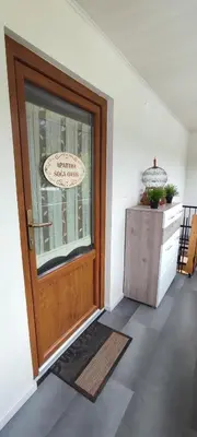 a door with a sign on it in a room at Apartma Soča Oasis in Srpenica