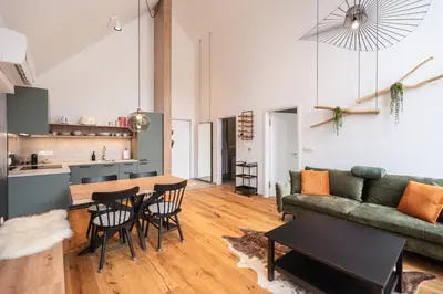 a living room with a couch and a table at Soca Valley Suites in Bovec