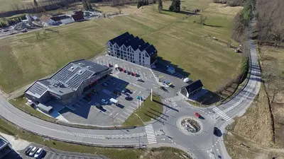 an aerial view of a building with solar panels at Soca Valley Suites in Bovec