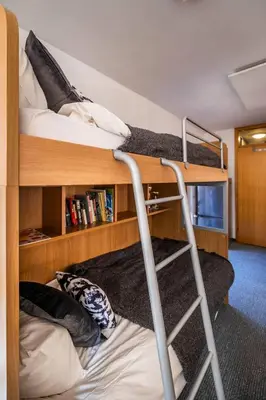 a room with two bunk beds and a ladder at Riversound in Kranjska Gora
