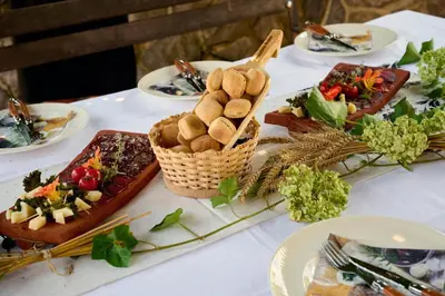 a table with plates of food on top of it at Four-Bedroom Villa Bajer in Stari Trg pri Ložu