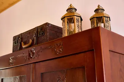 a wooden cabinet with two towers on top of it at Four-Bedroom Villa Bajer in Stari Trg pri Ložu