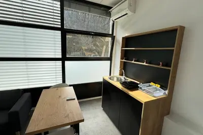 a small office with a desk and a window at Simba Studio Apartment A in Smarjeske Toplice