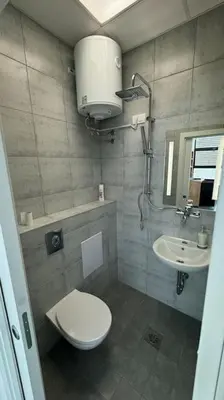 a bathroom with a toilet and a sink at Simba Studio Apartment A in Smarjeske Toplice