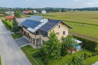 an aerial view of a house with solar panels on the roof at House Dijana With Pool - Happy Rentals in Nova Vas