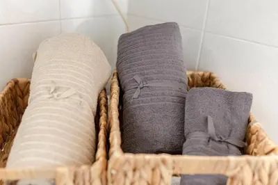 a basket filled with towels in a bathroom at Historical Caserne Apartment in Ljubljana