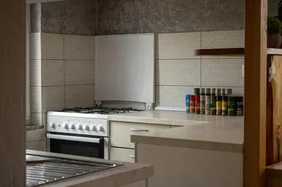 a kitchen with a stove and a counter top at Zidanica Vidrih in Dolenjske Toplice