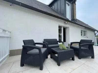 a group of chairs and a table on a patio at Apartma Tonii in Bovec