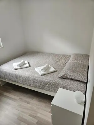a bedroom with a bed with two white towels on it at House Tereza near Olimje, Podčetrtek in Pristava pri Mestinju