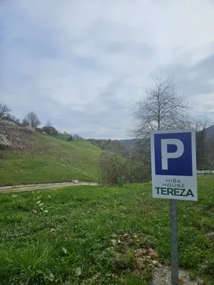 a blue parking sign in a field of grass at House Tereza near Olimje, Podčetrtek in Pristava pri Mestinju