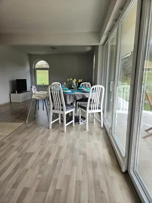 a dining room with a table and chairs at House Tereza near Olimje, Podčetrtek in Pristava pri Mestinju