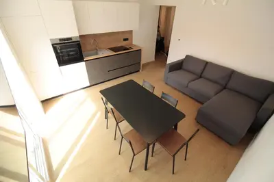 a living room with a table and a couch at Naia Apartments in Novo Mesto
