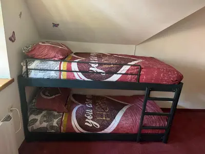 a room with two bunk beds and a bed at APARTMA MORAVSKE TOPLICE in Moravske Toplice