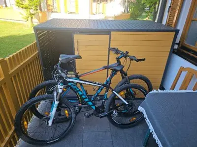 a bike parked on a porch next to a building at APARTMA MORAVSKE TOPLICE in Moravske Toplice