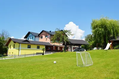 a yard with a soccer ball in the grass at Gostilna s prenocisci Danica in Slovenska Bistrica