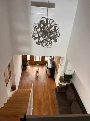 a chandelier hanging from the ceiling in a living room at LiLan apartment in Maribor