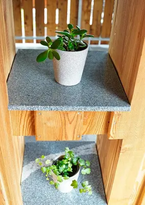 two pictures of a potted plant on a counter at Apartment Pr'pek in Bohinj
