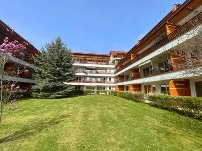 an apartment building with a yard in front of it at Apartment Hakuna Matata in Moravske Toplice