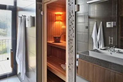 a bathroom with a sink and a shower and a tub at Oranda Village in Rogaška Slatina