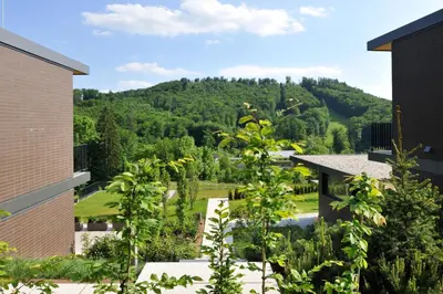 a view from the balcony of a house with a mountain at Oranda Village in Rogaška Slatina