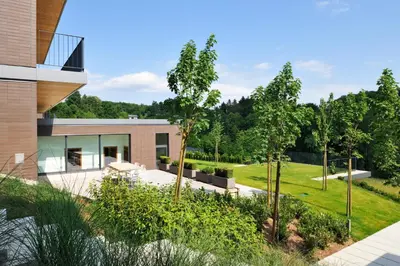 a house with a garden in front of it at Oranda Village in Rogaška Slatina