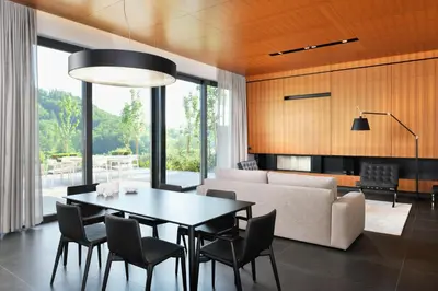a living room with a table and a couch at Oranda Village in Rogaška Slatina