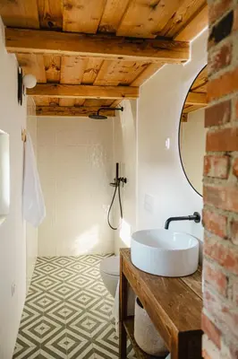 a bathroom with a sink and a toilet in a room at MÓD in Lendava