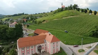 an aerial view of a house on a hill with a vineyard at Rezidenca Sv. Peter in Malečnik