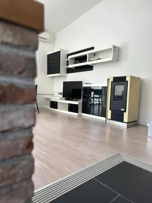 a living room with a tv and a couch at Apartment Štucin in Vipava