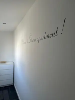 a white room with a sign appointment on the wall at Apartment Štucin in Vipava