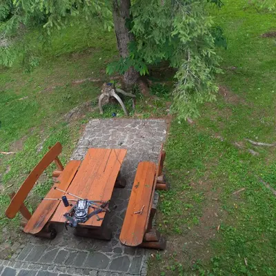 an overhead view of a picnic table in a park at Koča v gozdu, Forest house near Bled in Bled