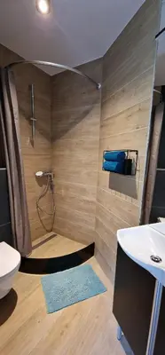 a bathroom with a toilet and a sink at Studio Apartment Aurora in Škofljica