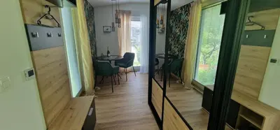 a room with a table and a dining room at Studio Apartment Aurora in Škofljica