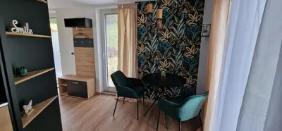 a small dining room with a table and chairs at Studio Apartment Aurora in Škofljica