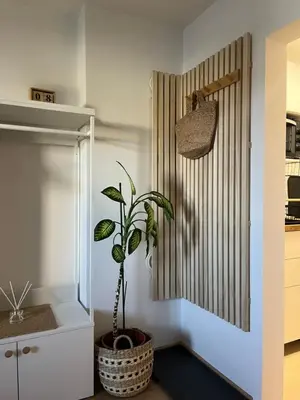 a plant in a pot next to a door in a kitchen at Deteljica in Kočevje