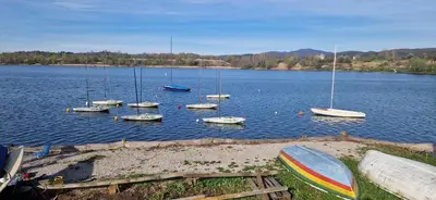 a group of boats in a large body of water at Deteljica in Kočevje