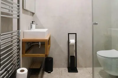 a bathroom with a sink and a toilet at Lilija apartments in Trzin
