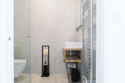 a bathroom with a sink and a toilet at Lilija apartments in Trzin
