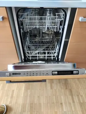 a dishwasher with its door open on a floor at Sunshine apartment Bled in Bled