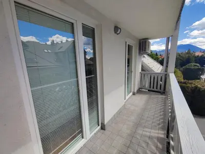 a balcony of a house with blinds on it at Sunshine apartment Bled in Bled
