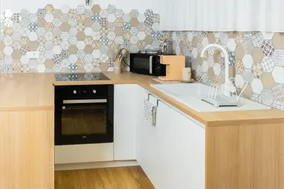 a kitchen with a sink and a microwave at Bubbly Apartment in Bled