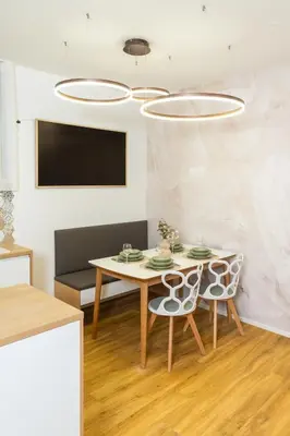 a dining room with a table and two chairs at Bubbly Apartment in Bled