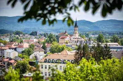 a view of a city with a church and buildings at Apartments Jantar in Novo Mesto