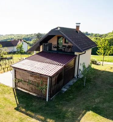 a house with a deck on the side of it at APARTMA ENI in Moravske Toplice