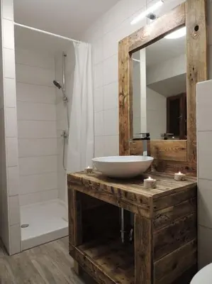 a bathroom with a sink and a mirror and a shower at Holiday House Damjana (Hiška Damjana), Ukanc, Bohinjsko jezero in Bohinj